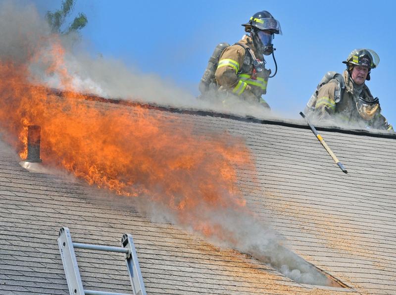 FF Jamie Harkins (L) and FF Steve Amway (R) after completing ventilation hole at townhouse fire in July 2012.