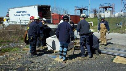 Fame members performing heavy lifting and moving obstacle course for ProBoard Structural Collapse II testing at the West Chester Fire Training Center. PA USAR Company 2 Box Truck 2 is seen in the background.