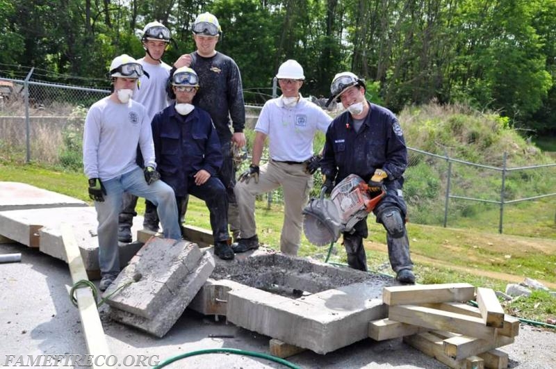 Fame Rescue Technicans after successful step-cut and clean lift out of reinforced concrete slab at FEMA USAR SCT Course. May 2015